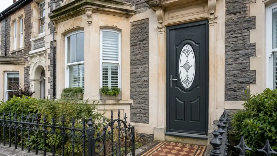 Anthracite grey Montana composite door shown on a Bristol stone house
