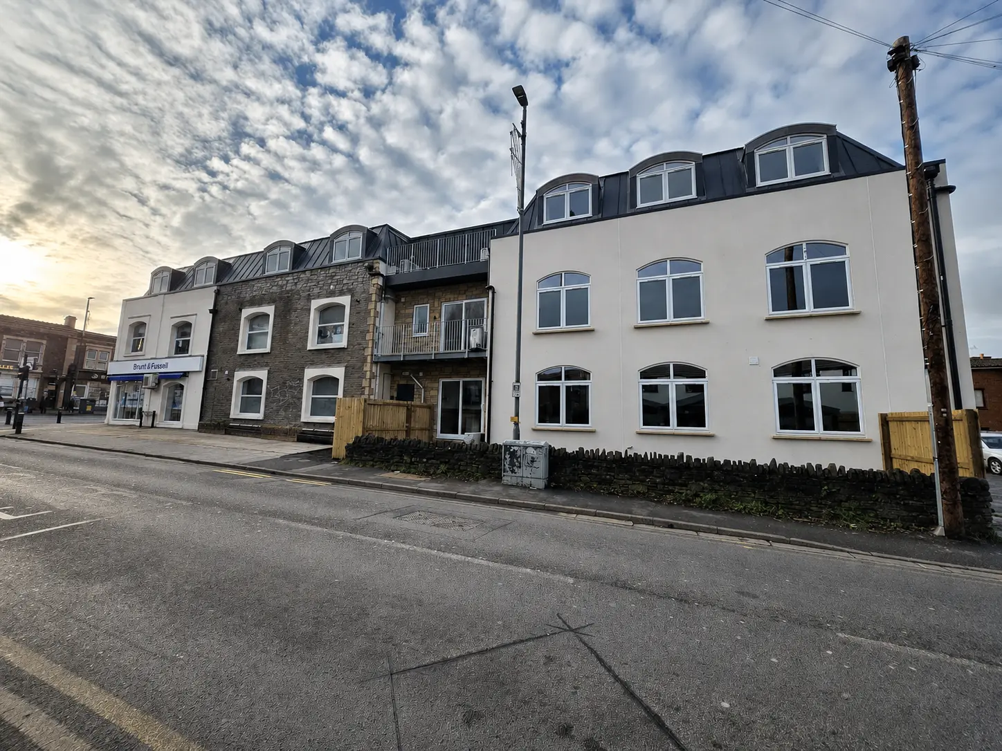 Newdaw Apartments at 141 High Street, Staple Hill, with white arched uPVC windows